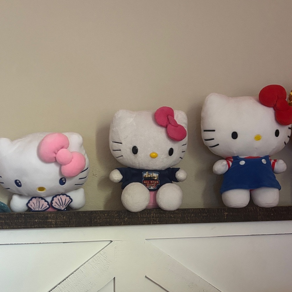 Hello Kitty Trio with Pink, Red, and Blue Outfits